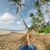 get paid to travel the world